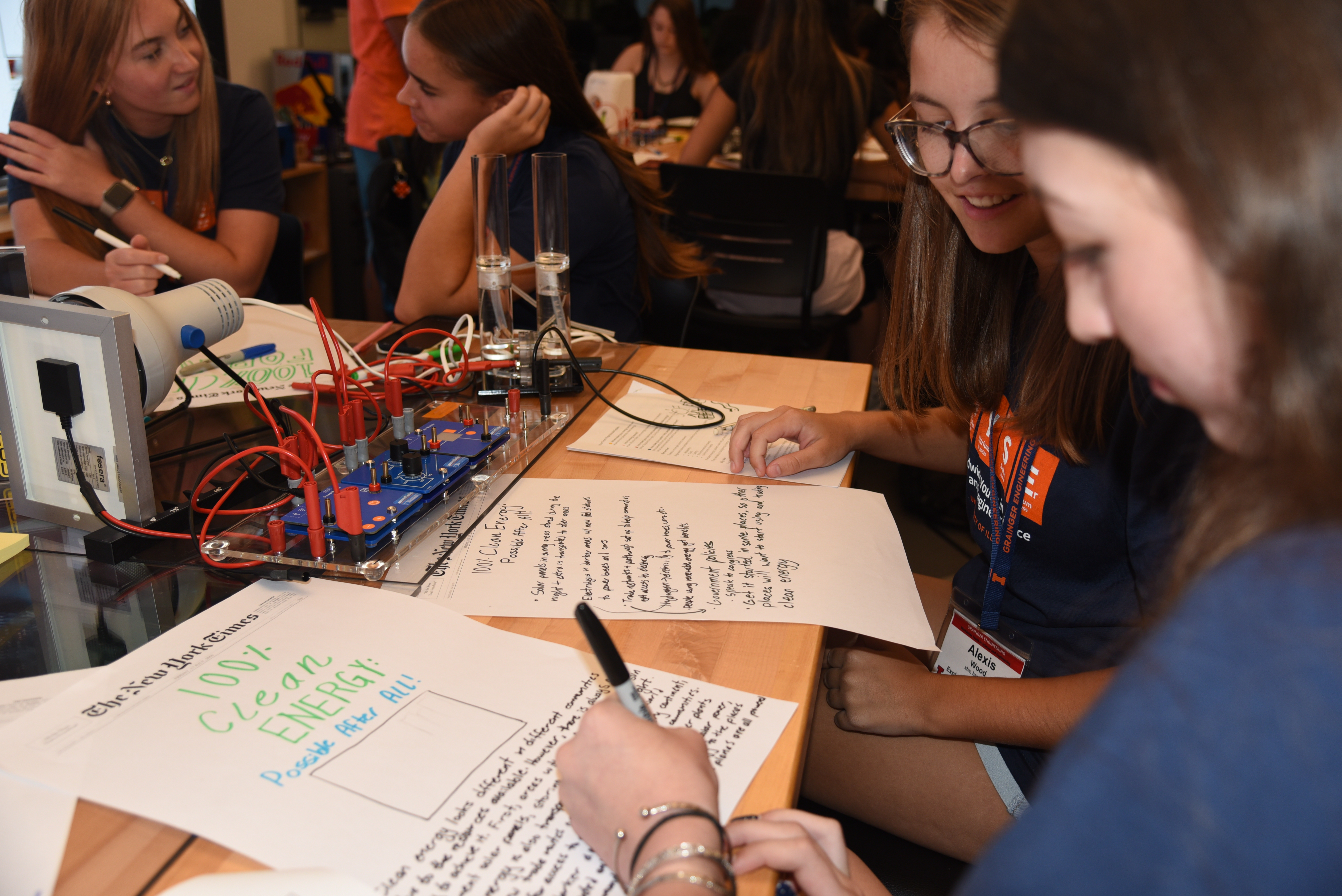 Students creating hypothetical newspaper headlines set in 2050, imagining the energy systems and communities they hope future engineers will help create.